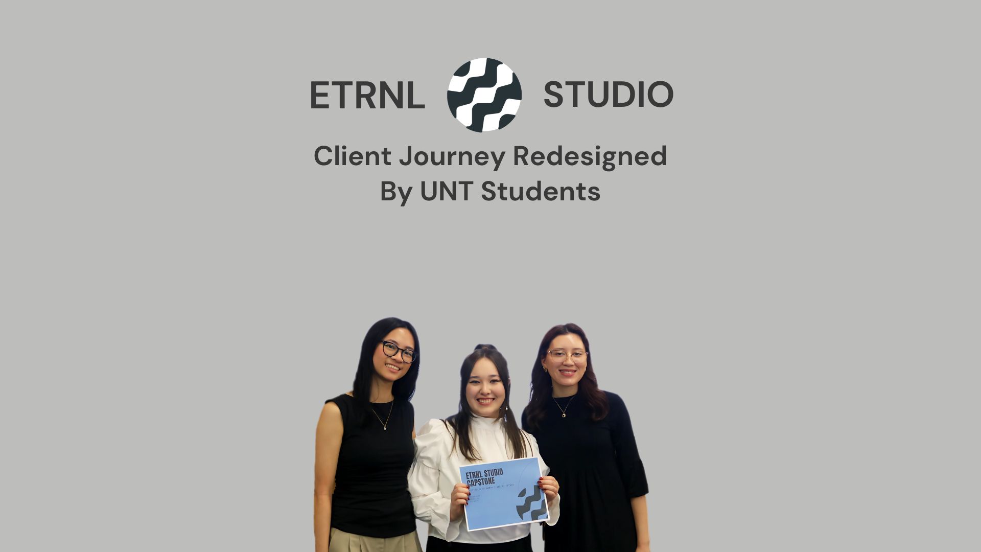 Three UNT students stand together smiling, one holding a certificate, in front of a blue background with the text ‘ETRNL Studio: Client Journey Redesigned by UNT Students.